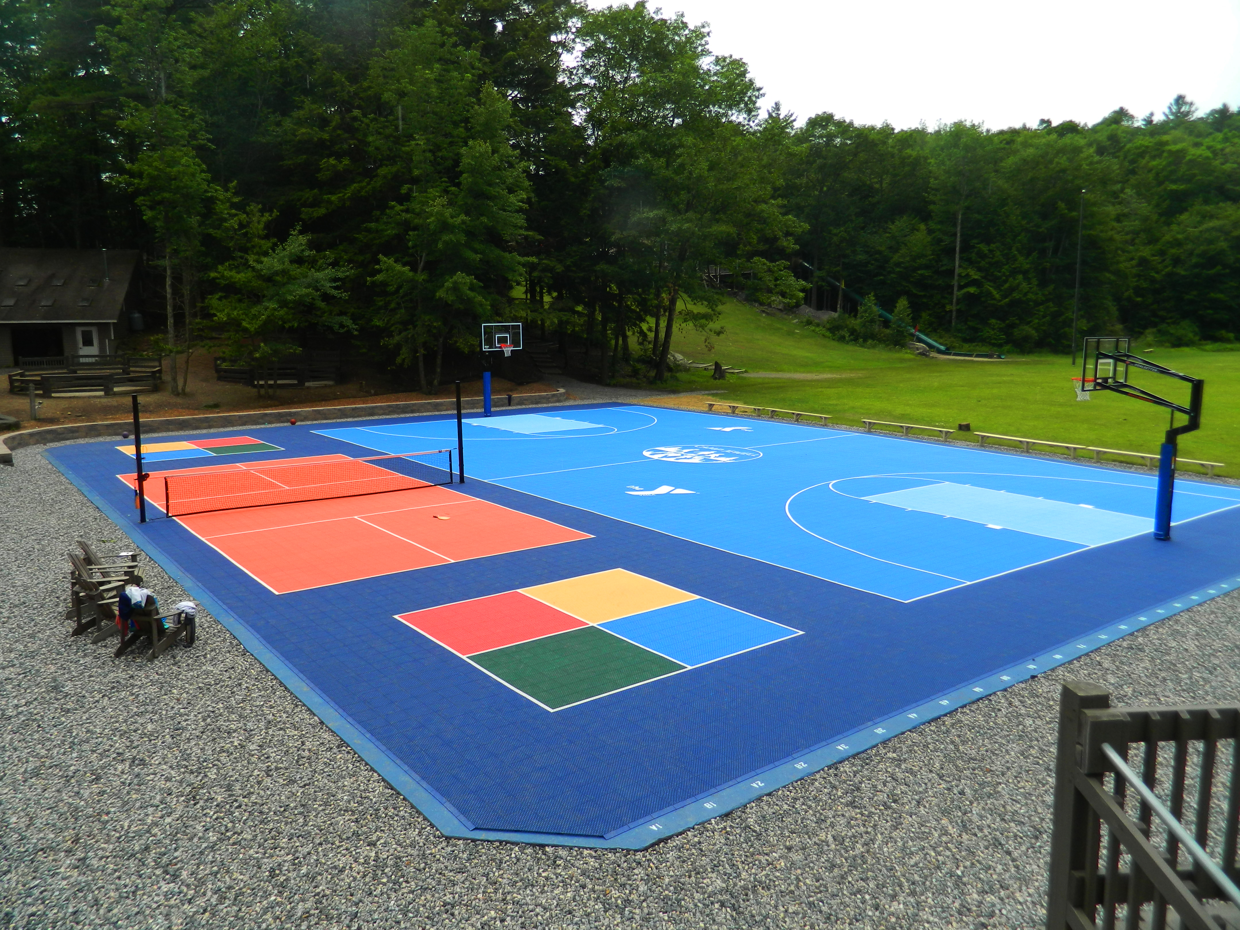 VersaCourt sport and game court featuring basketball, pickleball and 4-square