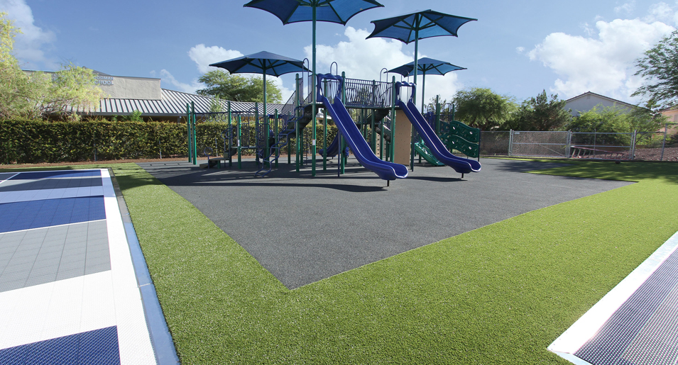 Kids playground with DuraFlex poured in place rubber surfacing and VersaCourt game courts